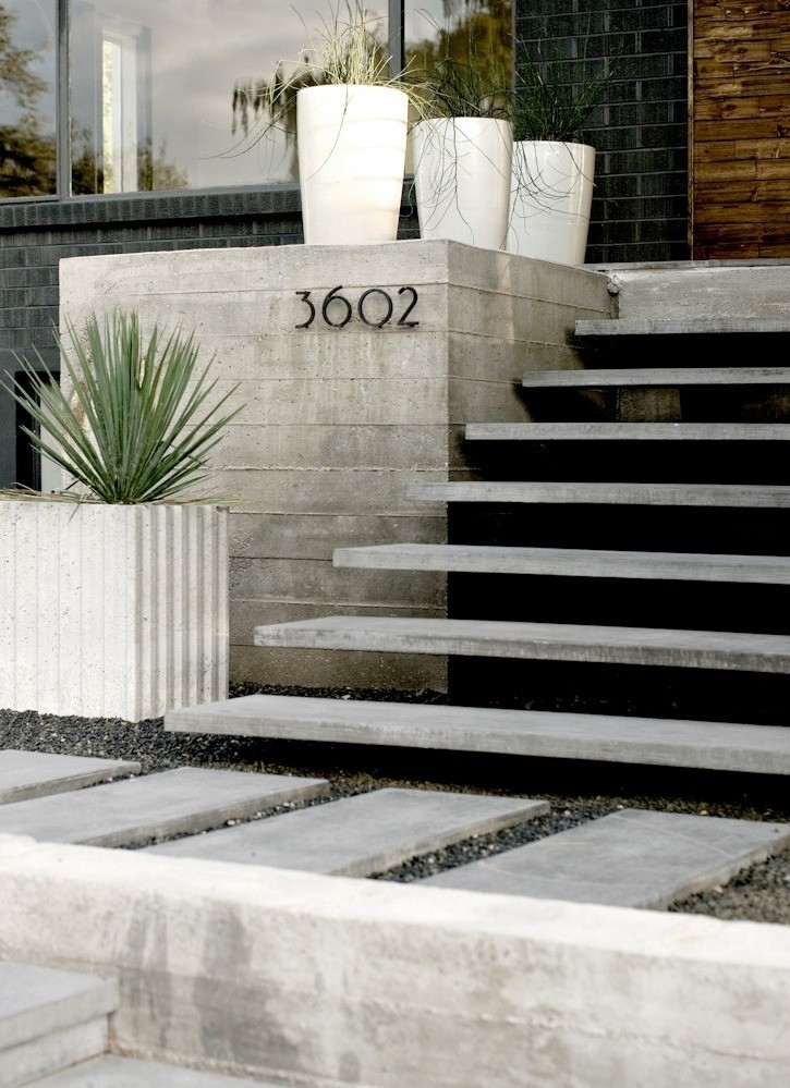 Floating concrete treads house numbers