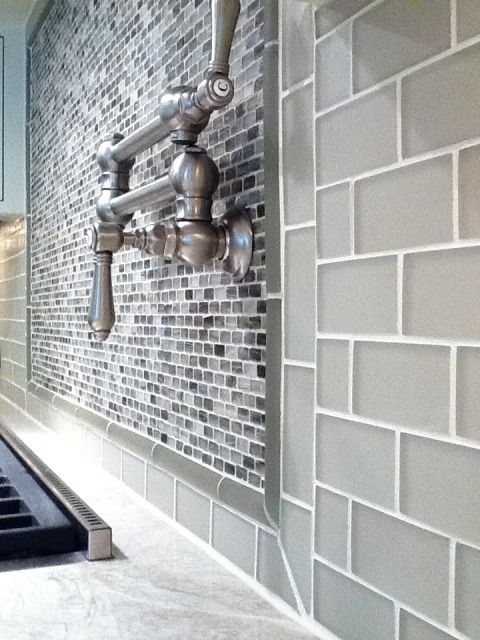 Gray backsplash tile glass mosaic under range