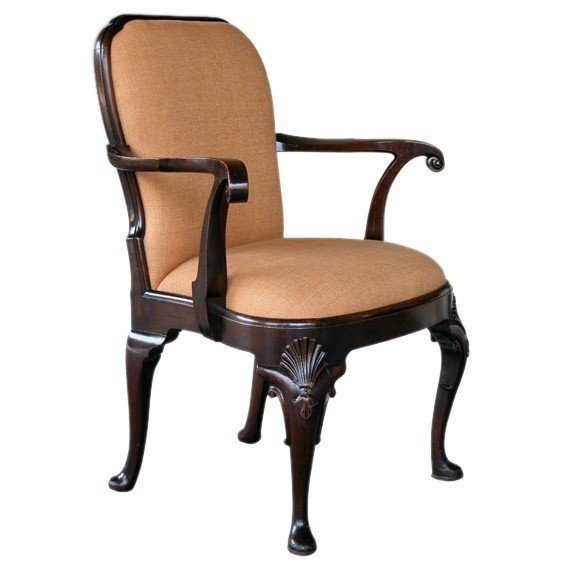 Handsome english queen anne style carved mahogany armchair with bold