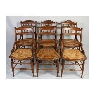 Six matching victorian walnut cane bottom chairs