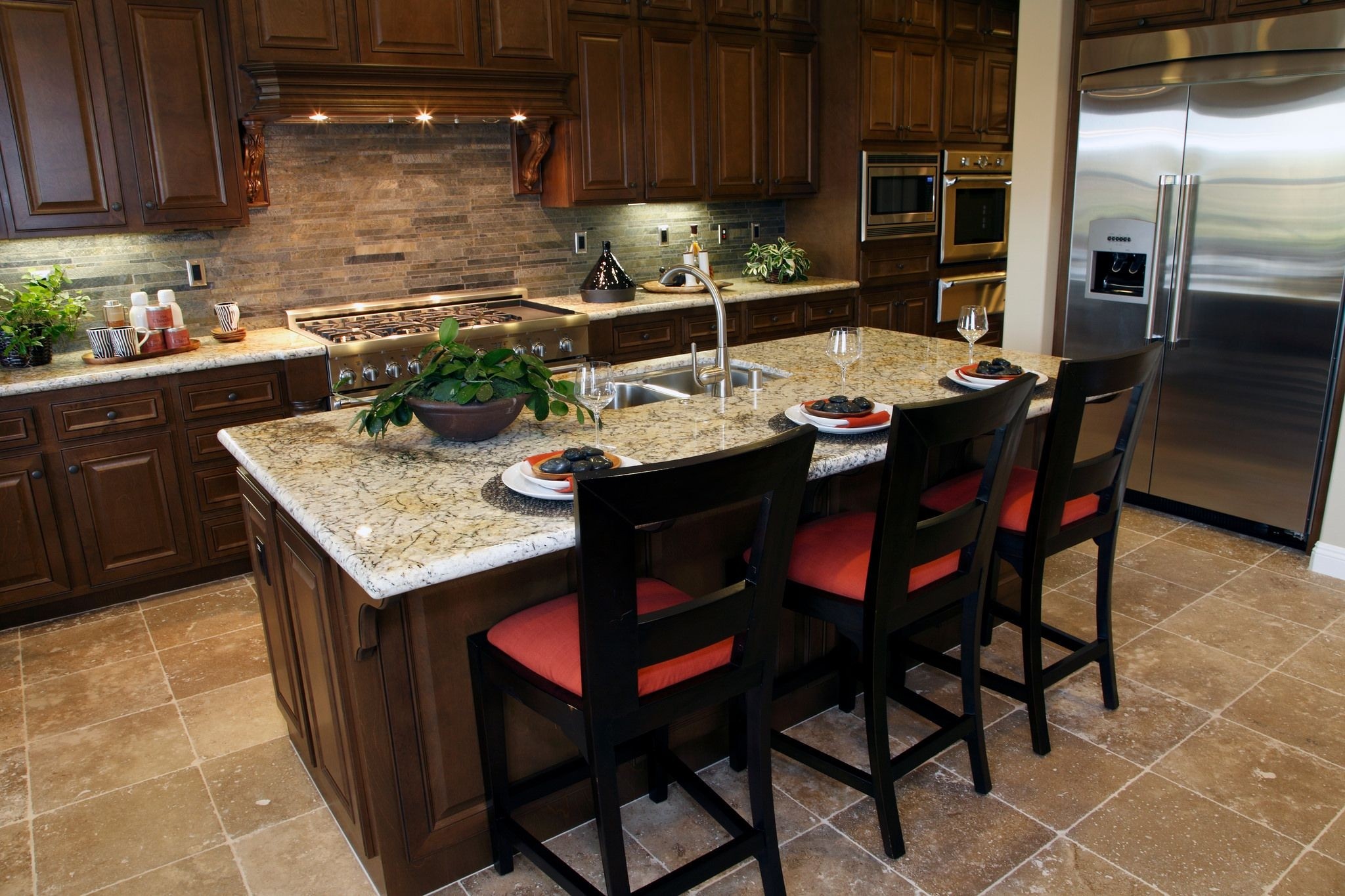 Luxury kitchen with dark wood cabinets an island that seats