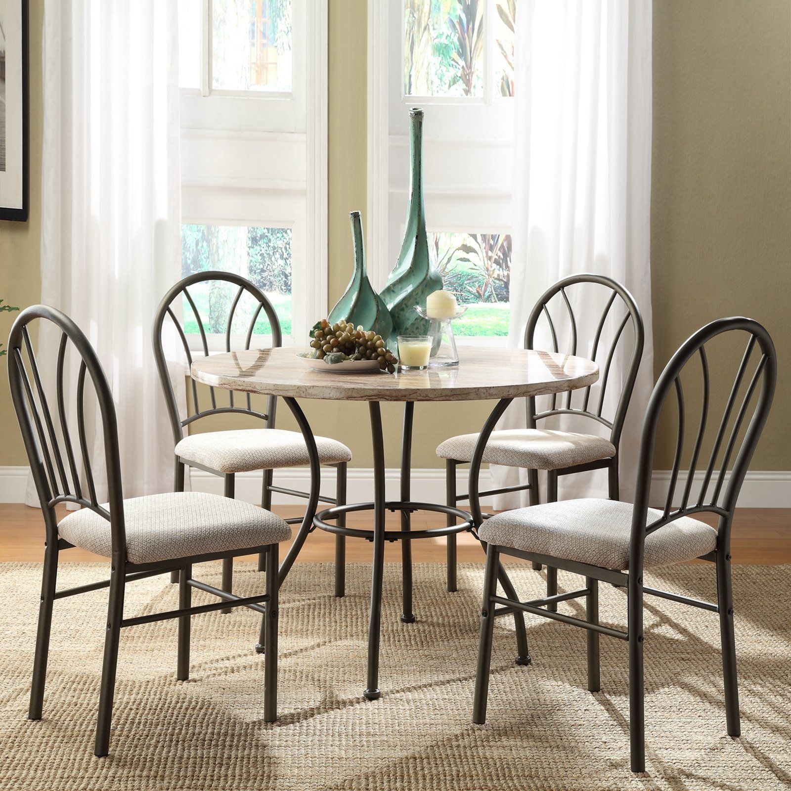 Take a look at this cream casual five piece dining