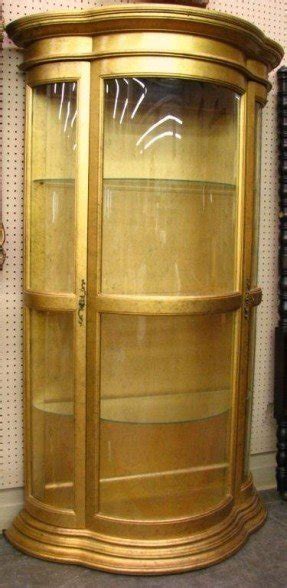 Gold finish curved glass curio cabinet