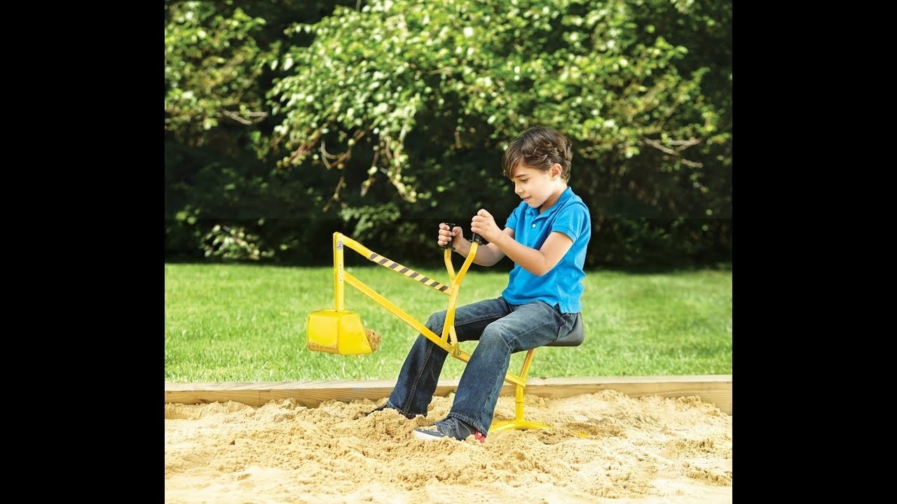 kids sit on excavator