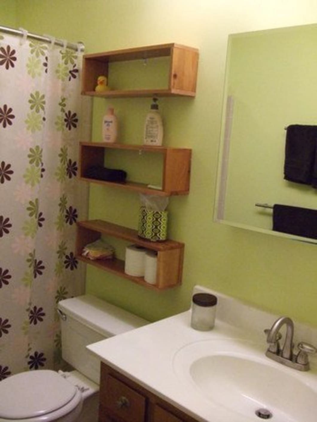 glass floating shelves in bathroom