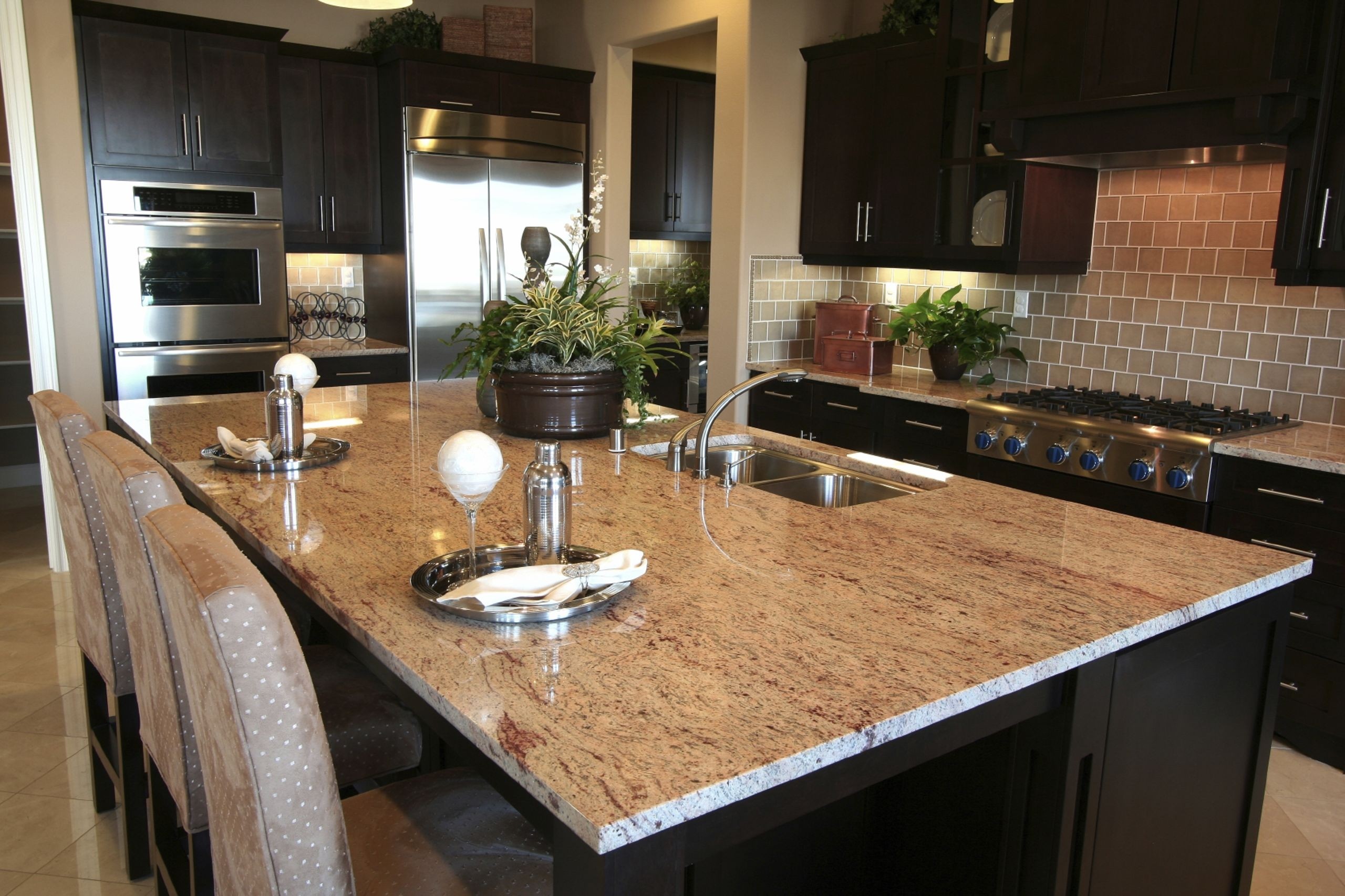 granite kitchen island attached to a wall