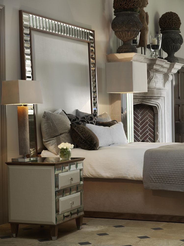 mirror behind bedside table