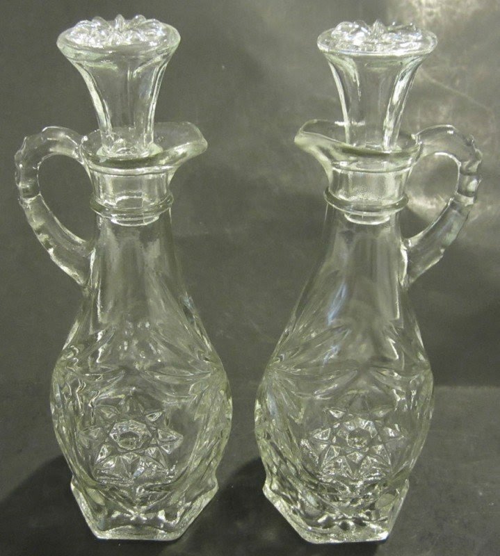 Pair of clear pressed glass oil vinegar cruets
