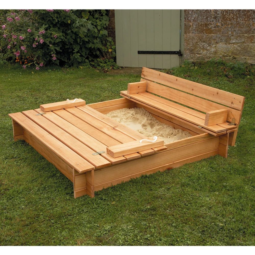 Wooden sandbox with cover