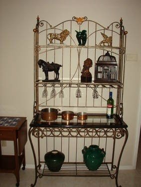 Wrought iron bakers rack with wood shelves