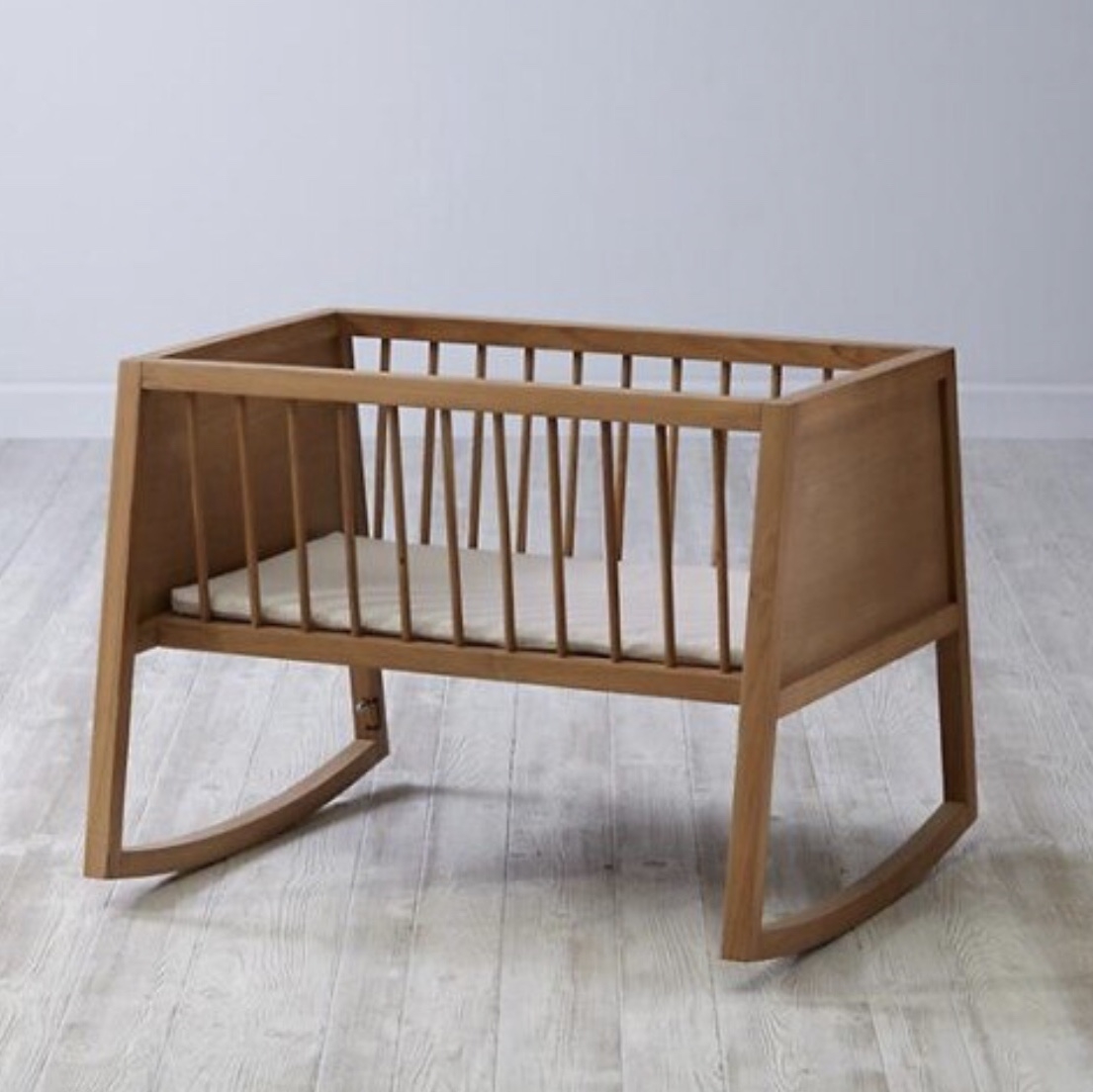 Inspired by vintage cradles our olin bassinet has a clean