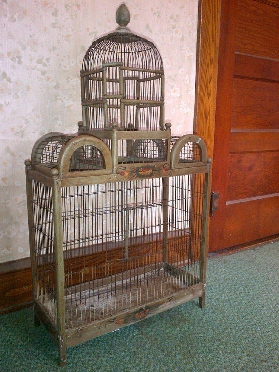 Stunning vintage bird cage in varying shades of green with