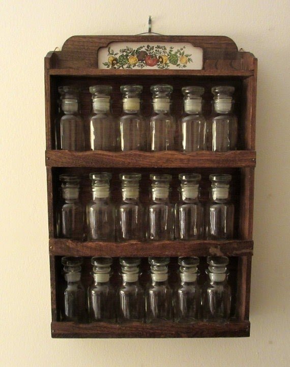 Vintage wall hung wooden spice rack with