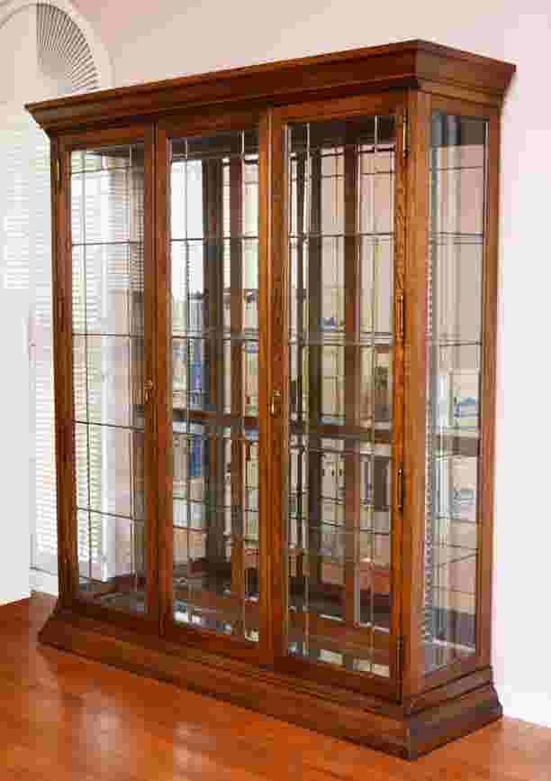Contemporary triple front oak curio cabinet
