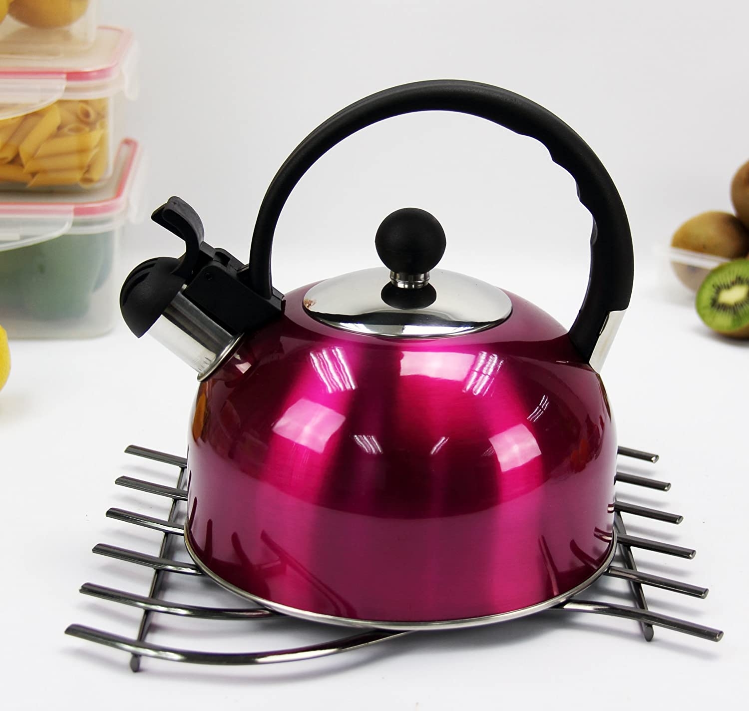 Pink whistling tea kettle