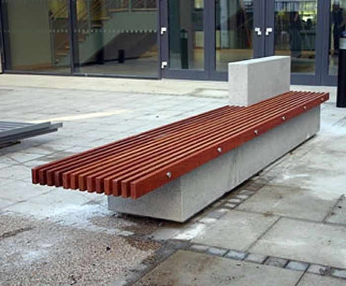 Soca bench with hardwood slats and a concrete base