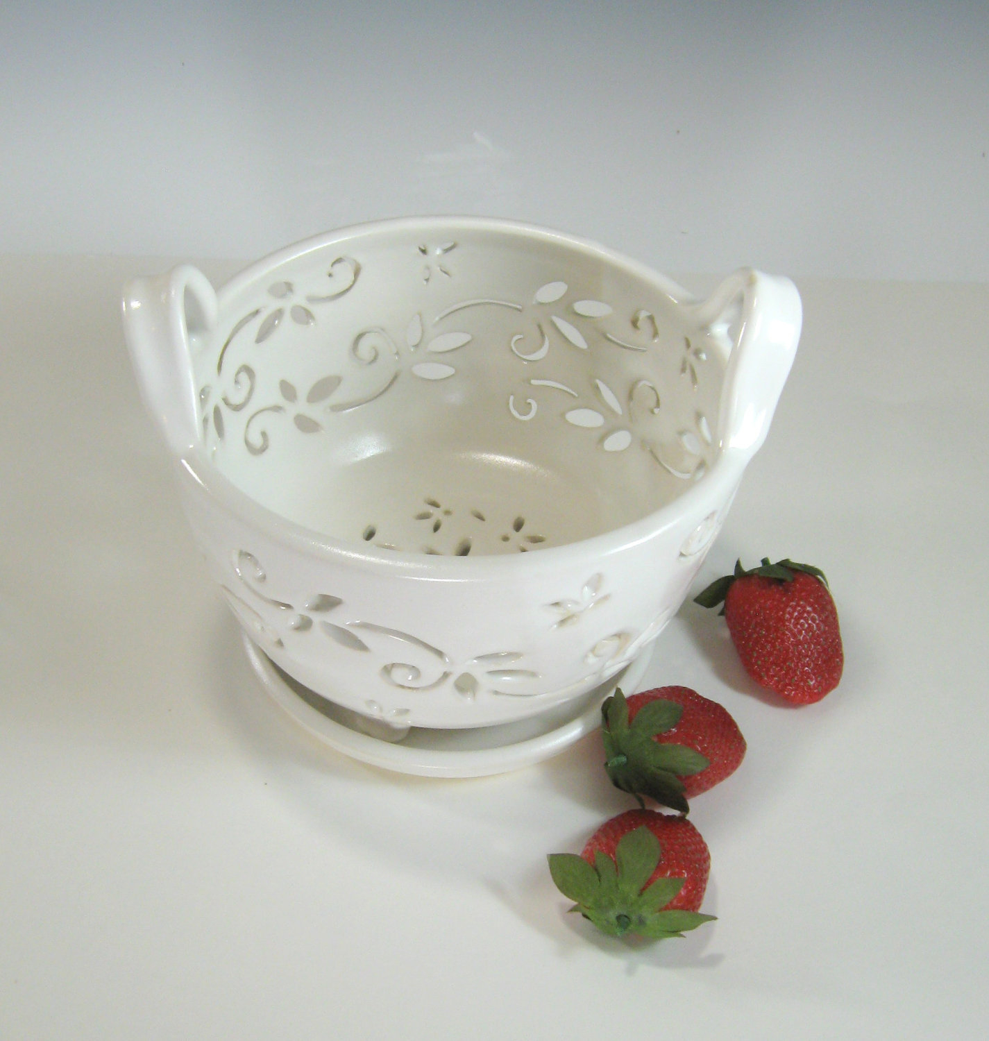 White fruit bowl with holes