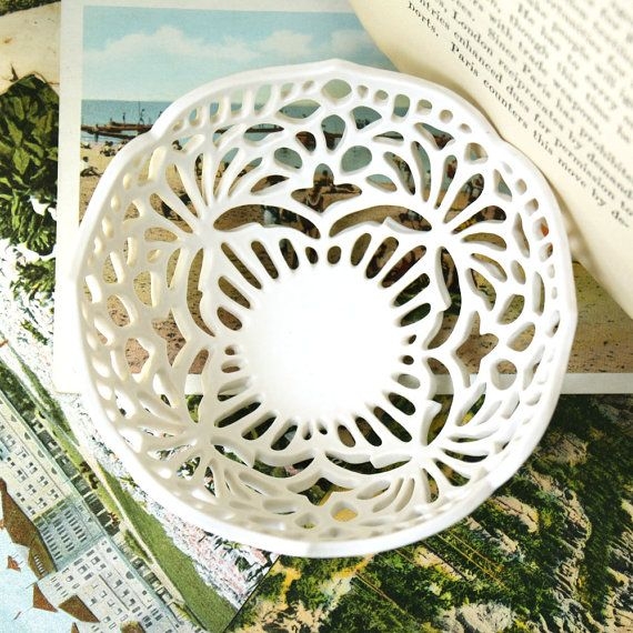 White porcelain bowl with delicate lace inspired carving measures approximately