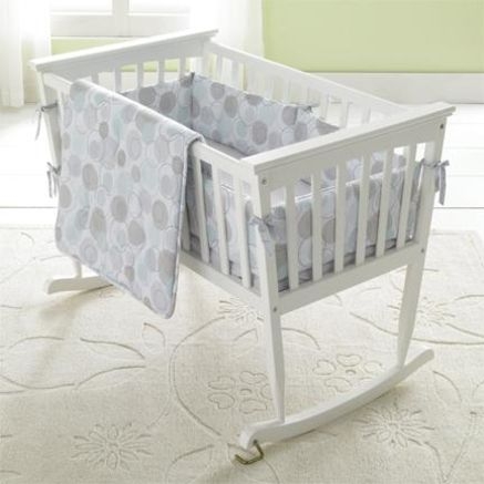 white wooden bassinet