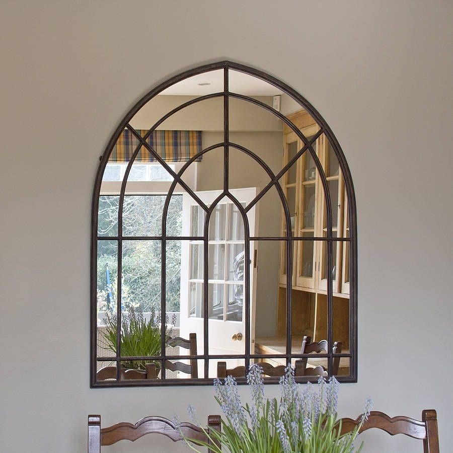 Aged metal arched wall mirror