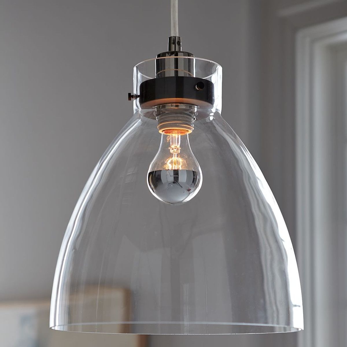 Minimalist glass pendant with an industrial design