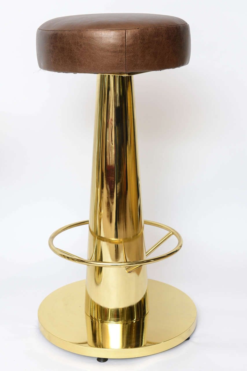 Set of four heavy brass plated bar stools from the