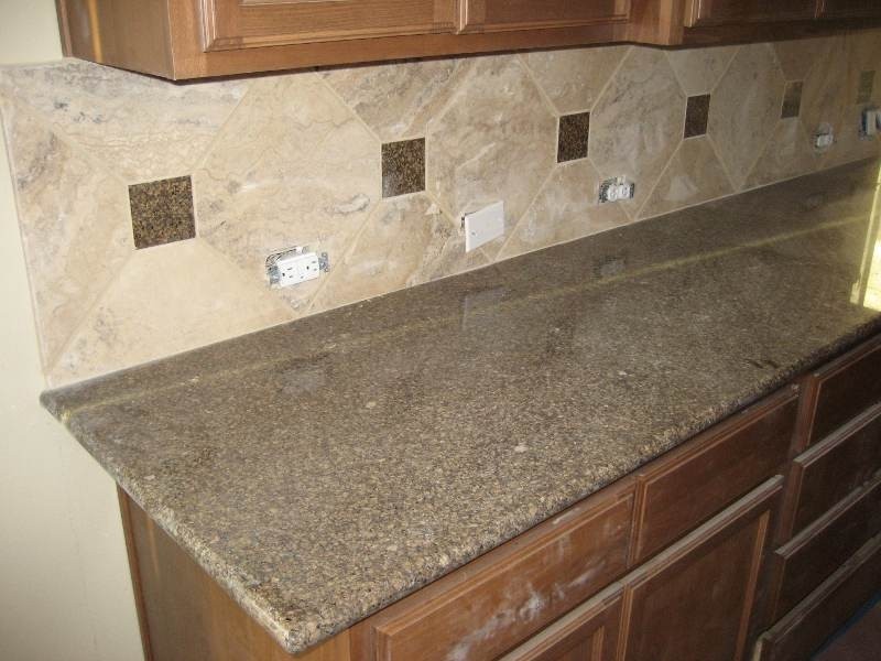 Kitchen backsplash made of small accent tiles in combination with