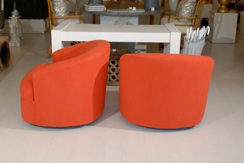Pair of orange swivel chairs image 7