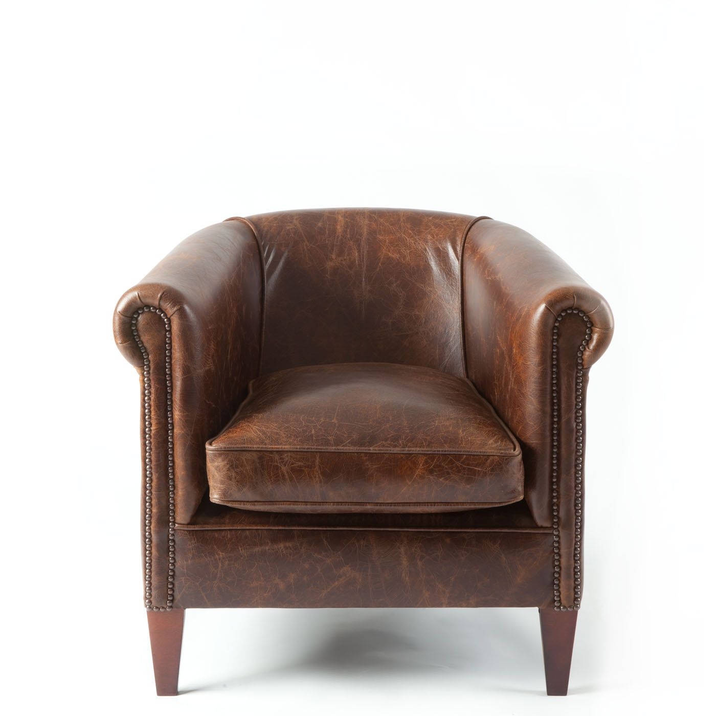 small brown leather tub chair