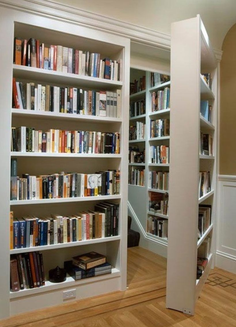 View in gallery a secret bookcase door under the stairs