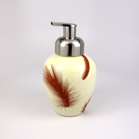 Creamy yellow glazed porcelain foam soap dispenser with feathers by