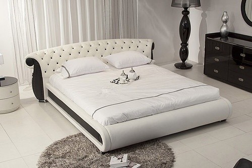 White leather platform bed with black accents tufted headboard modern