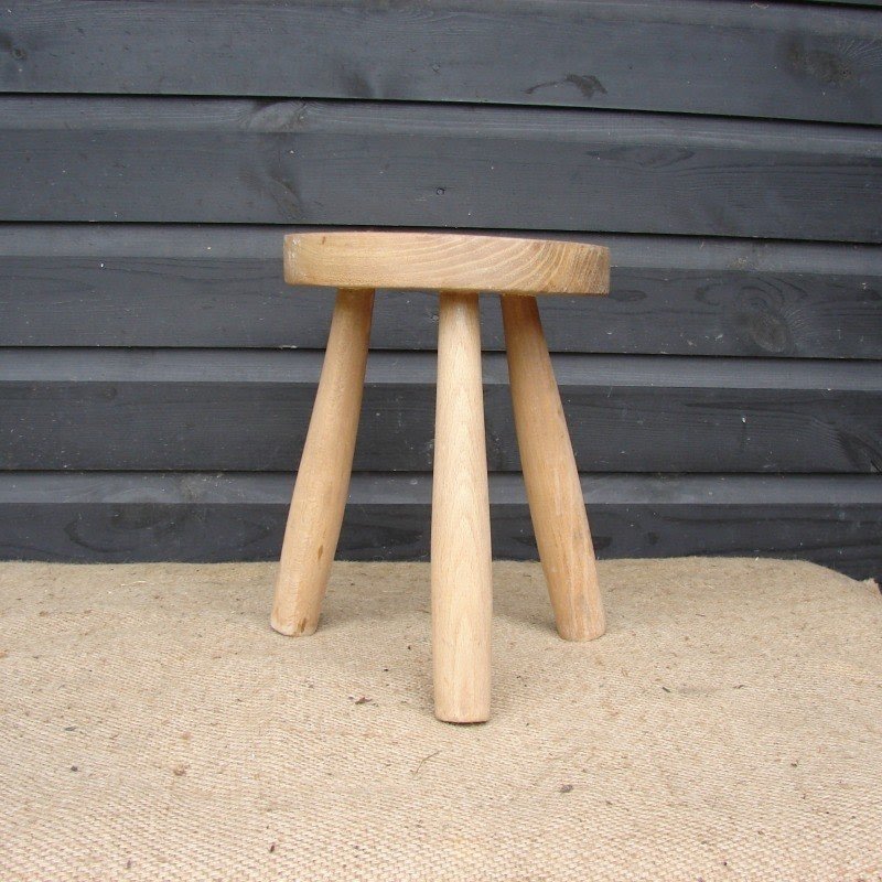 Small wooden milking stool
