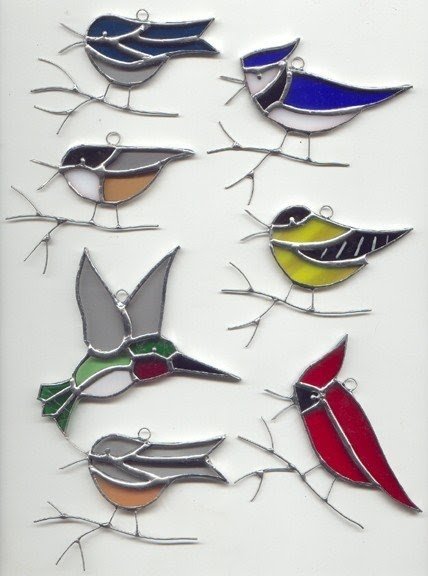 Stained glass birds on a branch