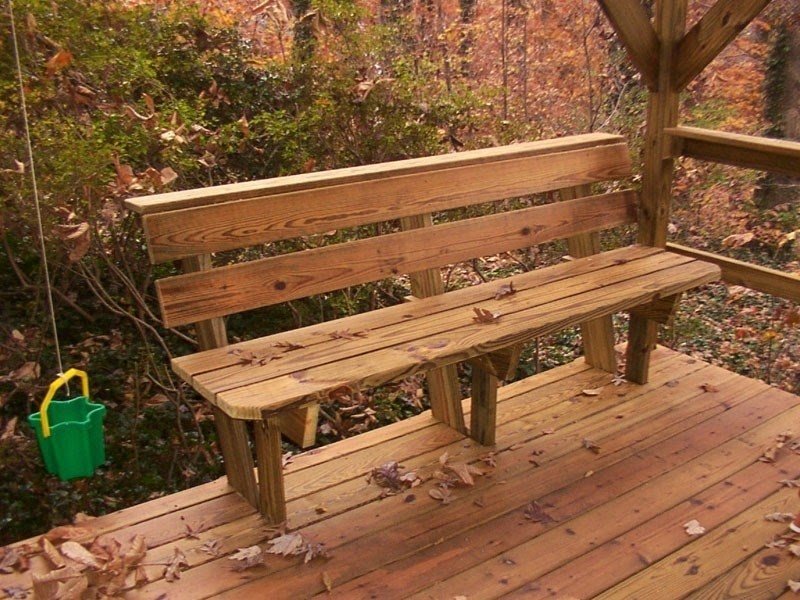 2004 bench on lower deck of stained tri level treehouse