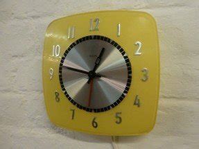 Yellow plastic wall clock