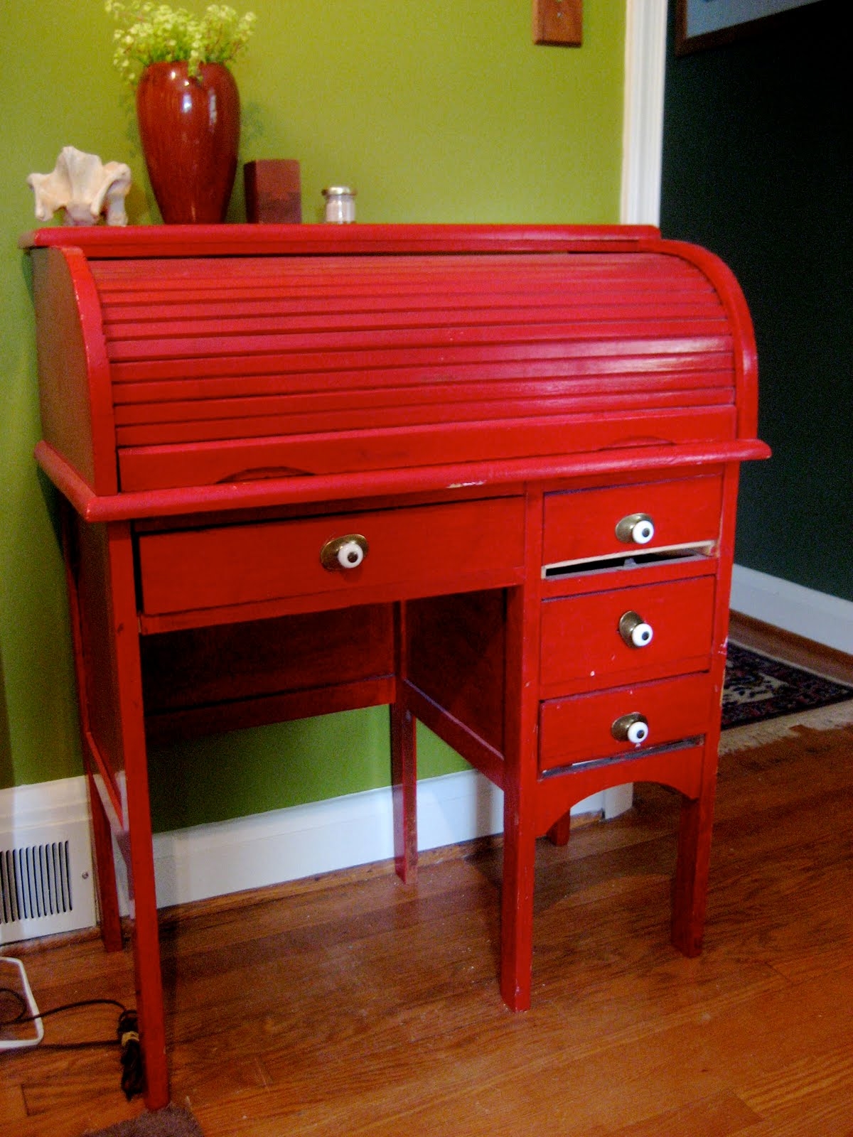 Small red roll top desk