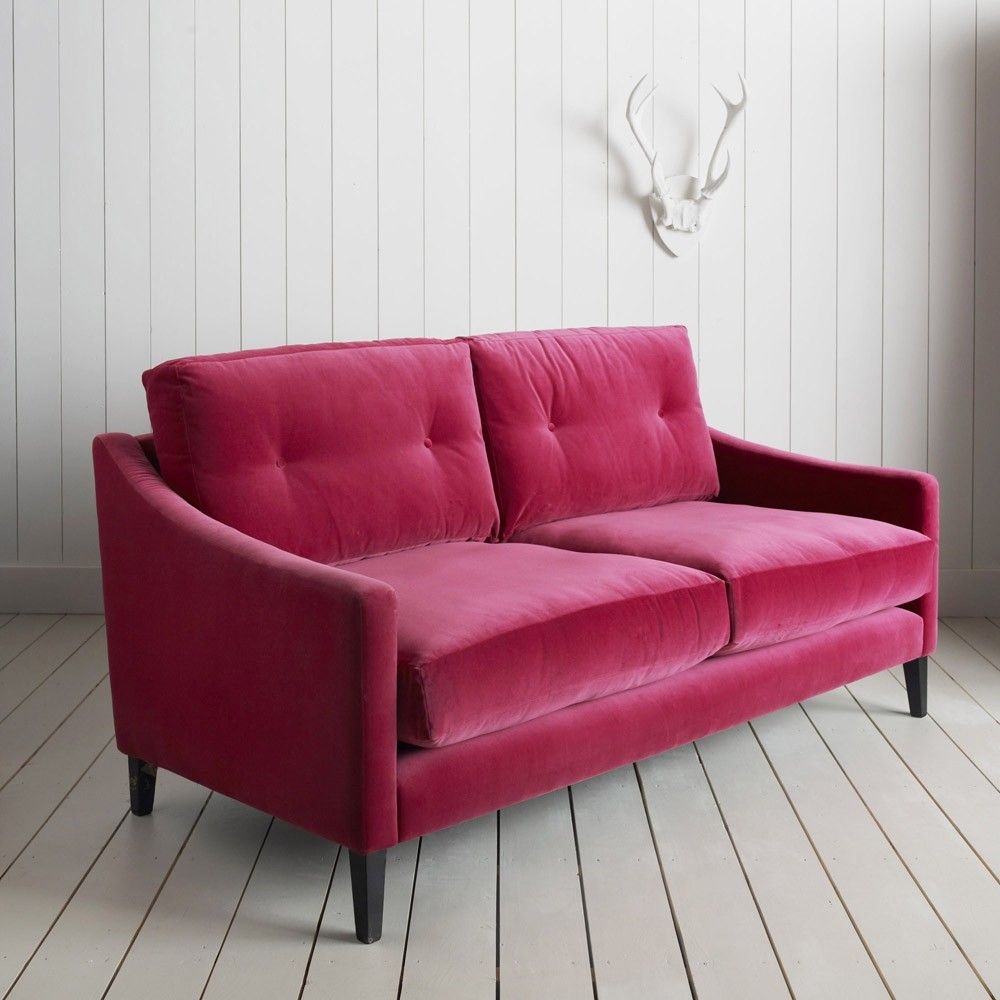 Pink tufted sofa