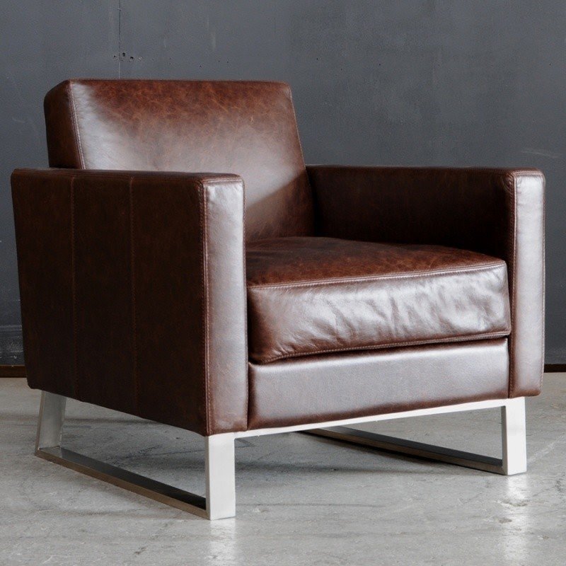 The cohen chair features top stitched full grain leather upholstery