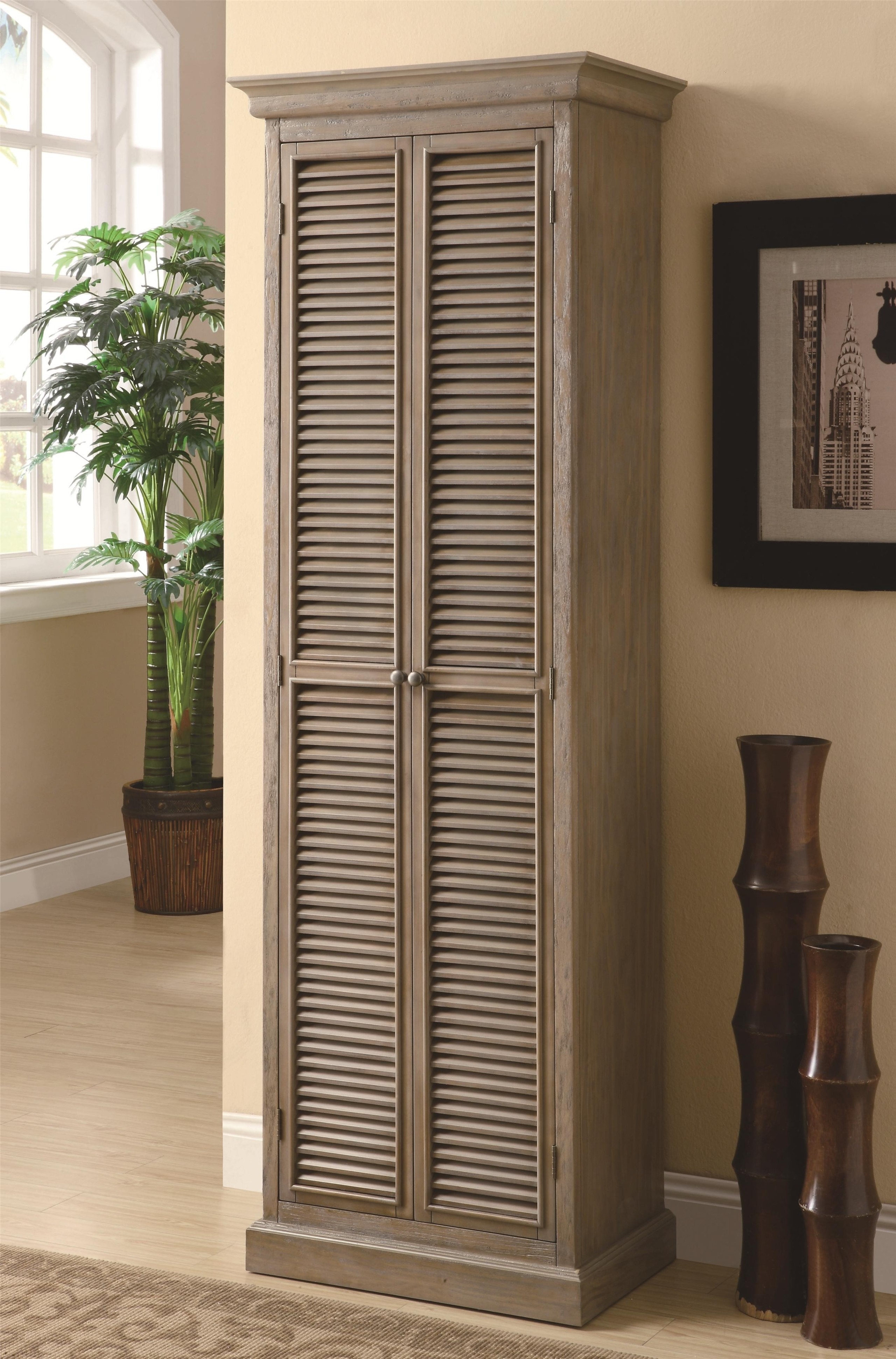 Tall storage cabinet with shutter door fronts by coaster