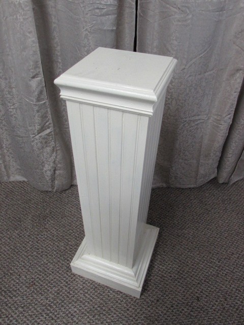 white wood pedestal