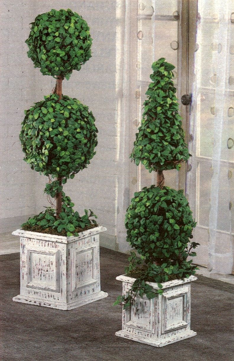 Topiaries on front porch either side of door regal entrance