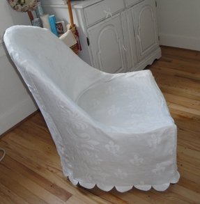 small white slipcovered chair