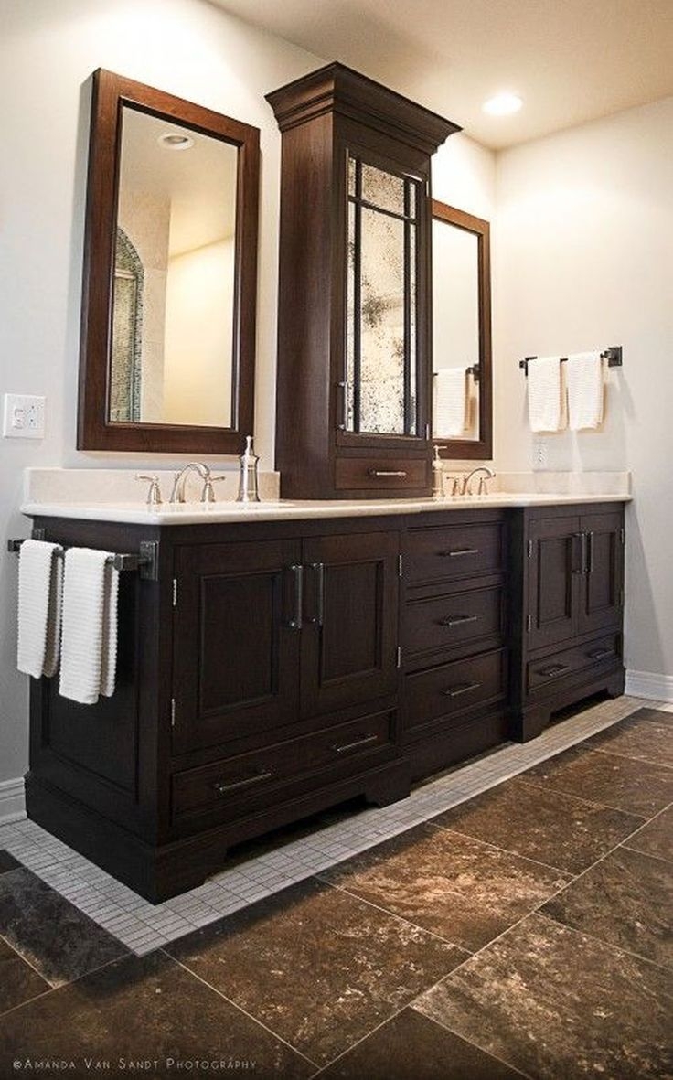 cabinet between mirrors in bathroom