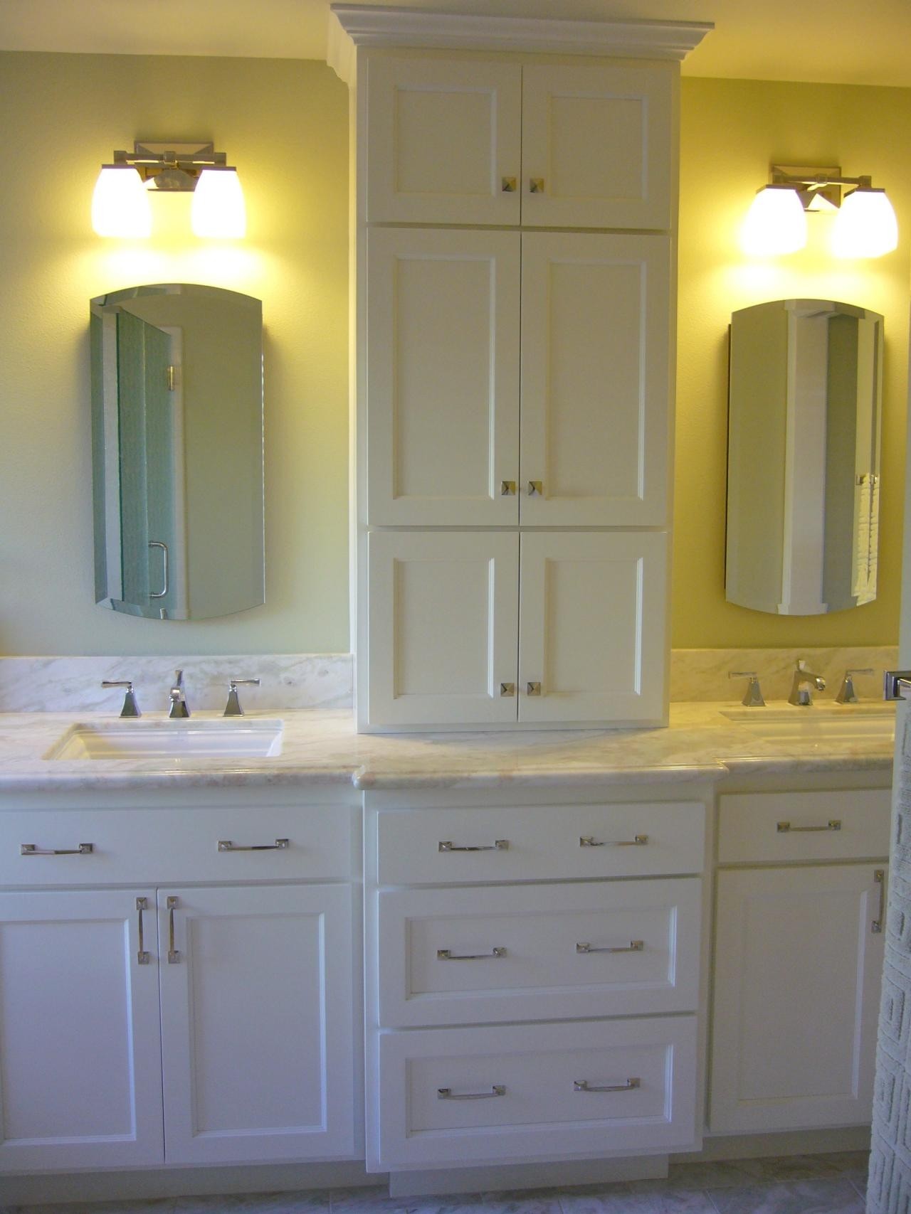 Custom bathroom cabinets to divide his and her vanity space