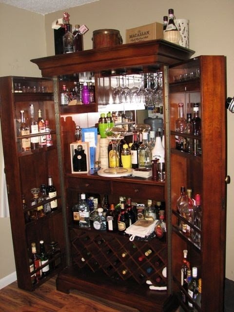 Howard miller clock hide a bar sonoma wine cabinet