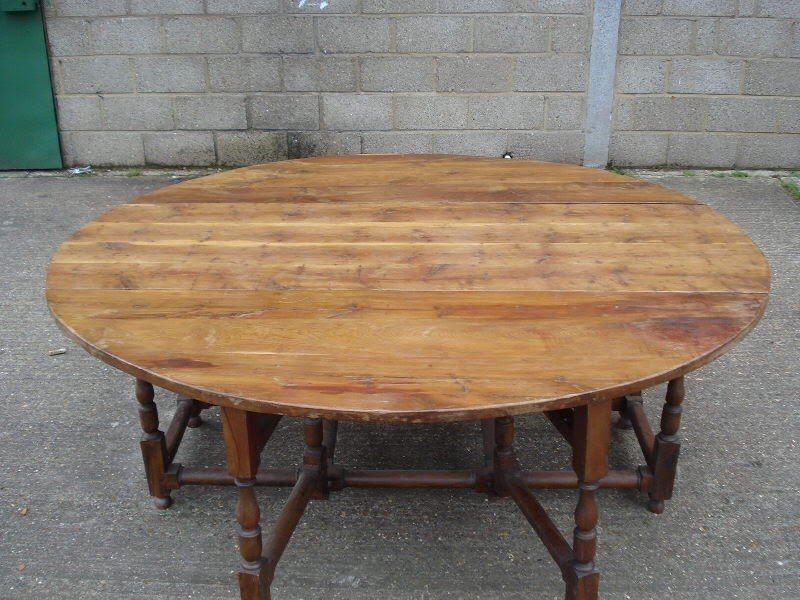 17th century revival yew wood dropleaf dining table to seat