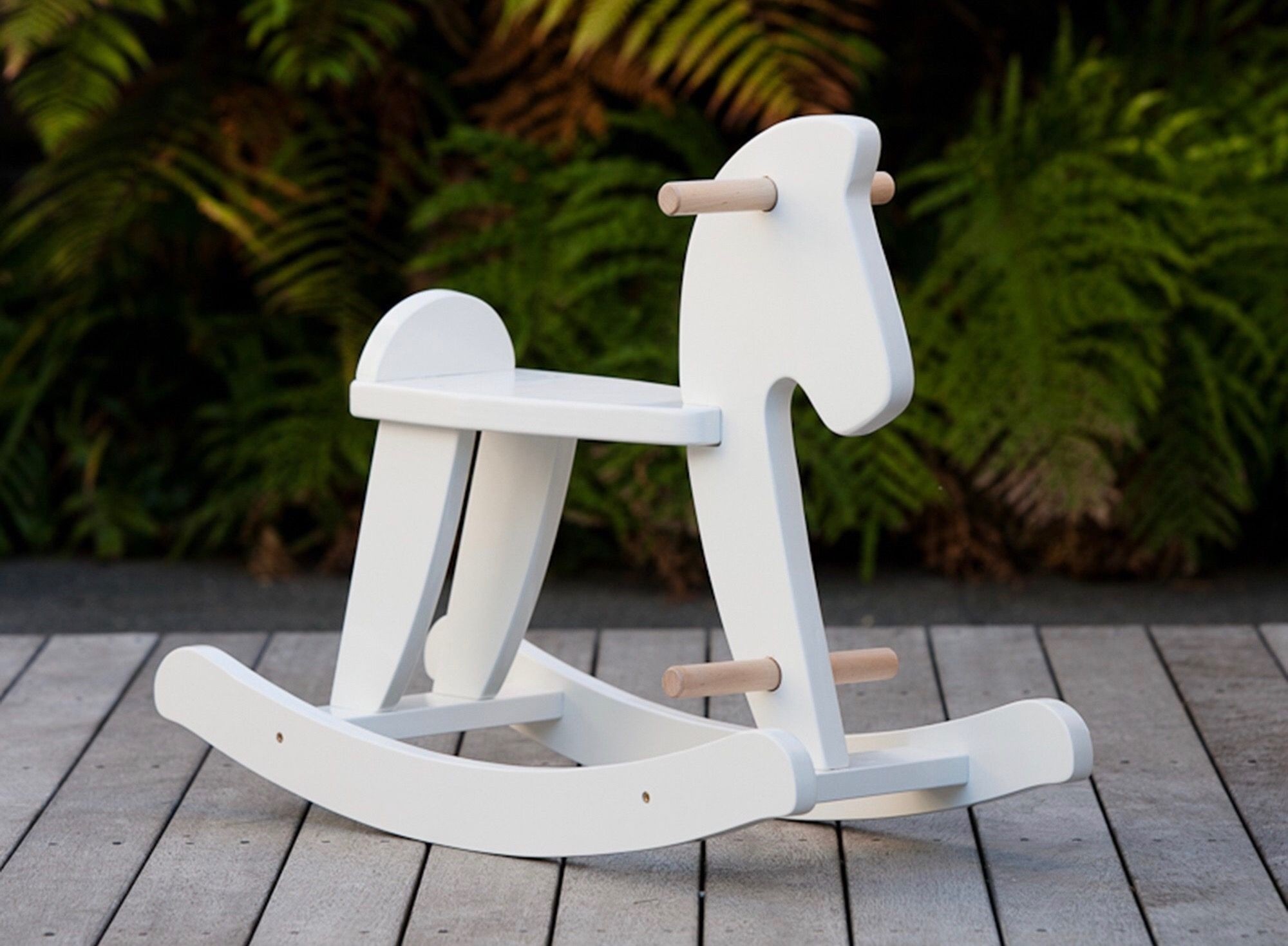 white wooden rocking horse