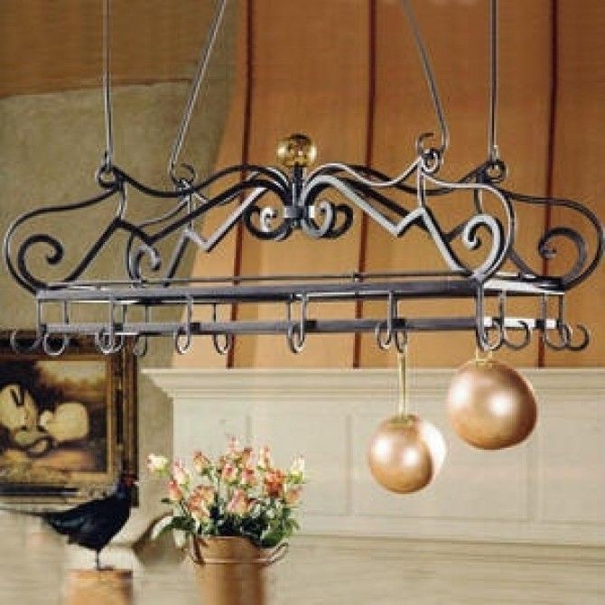The scrolled wrought iron pot rack with tortoise glass finial
