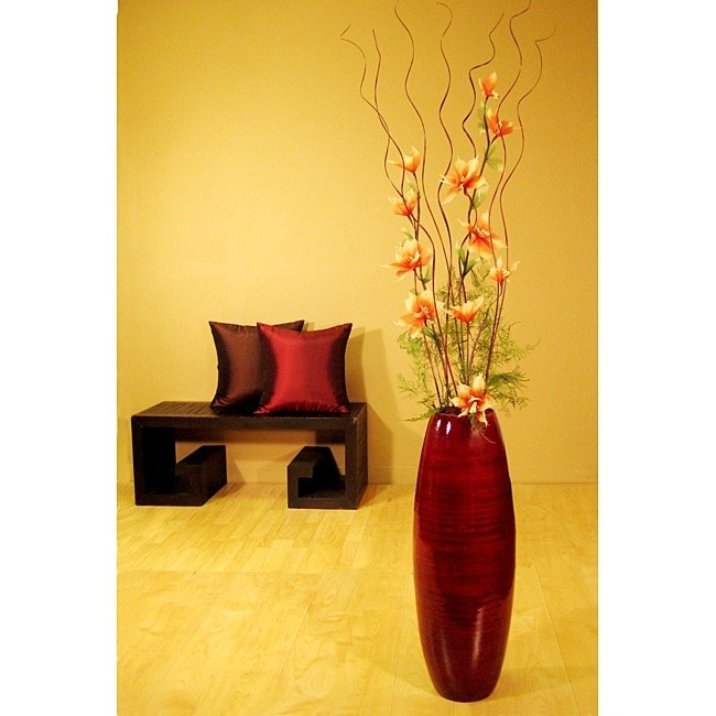Bamboo floor vase with orange red lilies